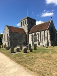The image is of St Mary and St Melor Church, Amesbury, dating from about 900. The church is built from an off-white stone.