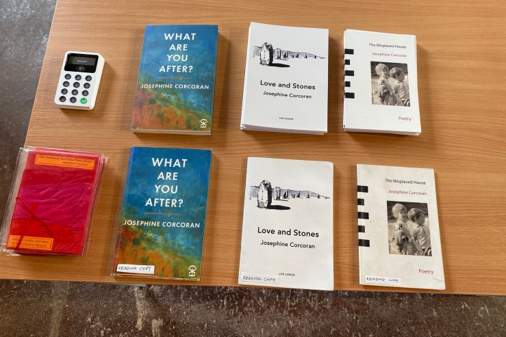 My four poetry books arranged on a table (for a recent reading I gave).