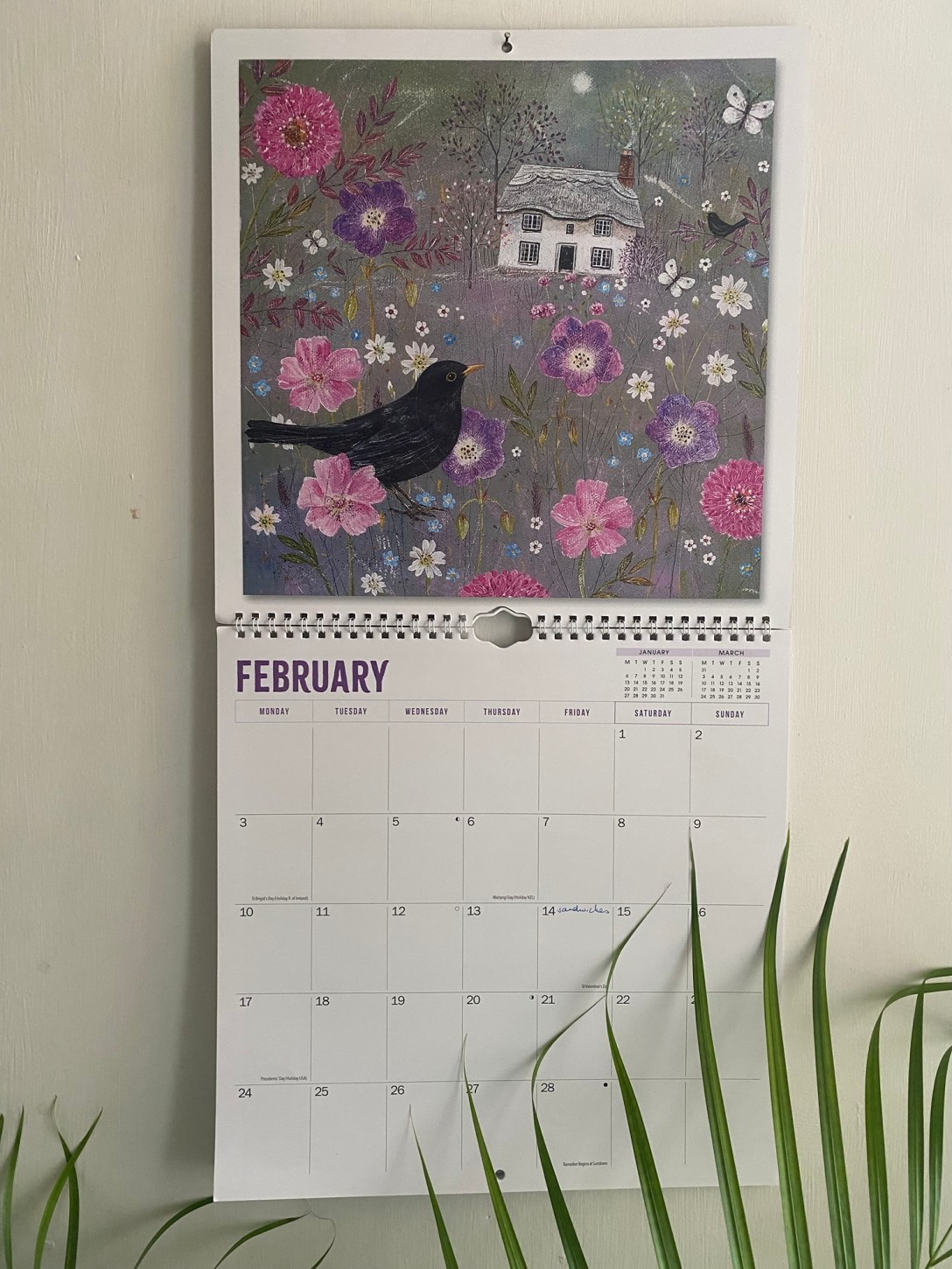 A picture of a wall callender open at February