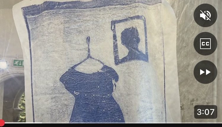 A still from the film Borderland Flow featuring an image of a child's dress on a clothes hanger