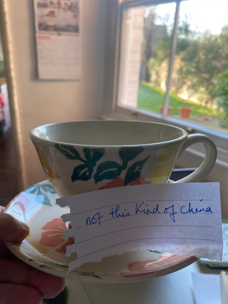 a picture of a teacup and saucer with the handwritten message attached "not this kind of china"